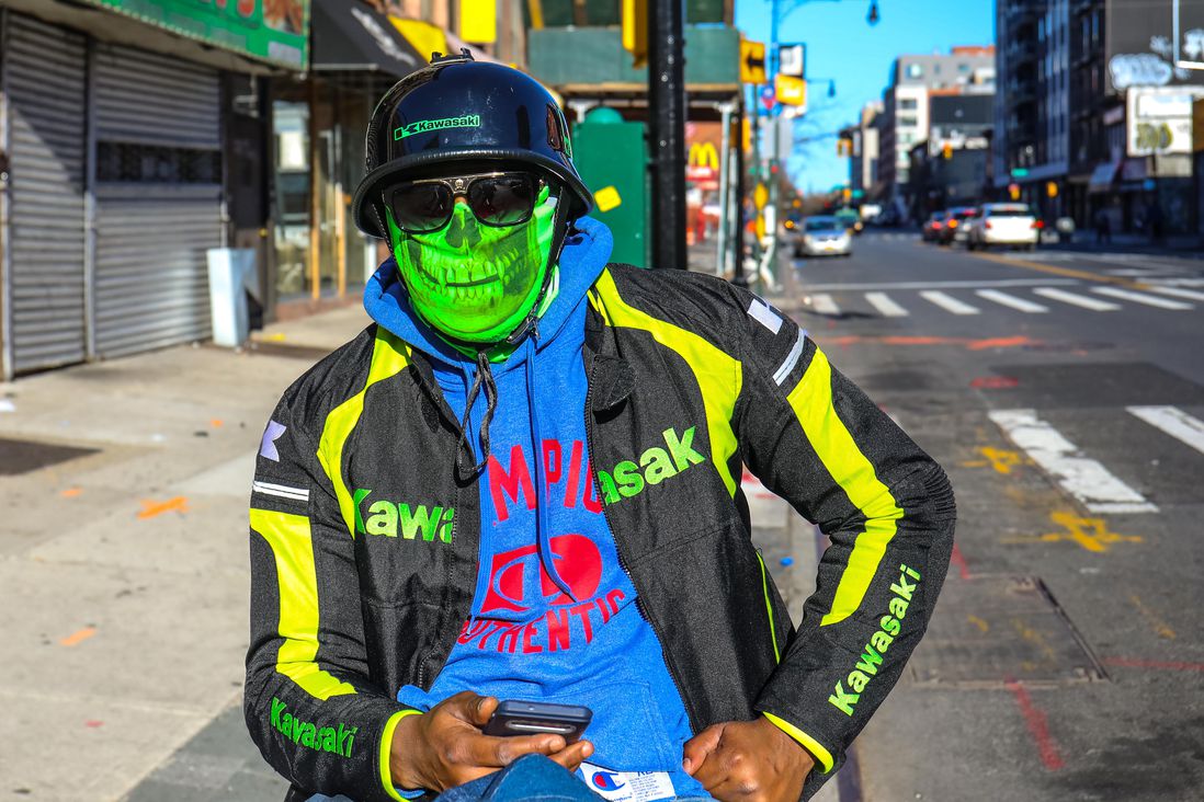Man in Bed-Stuy wearing colorful face covering